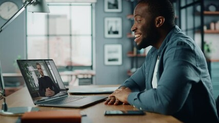 Aufkleber - Handsome African American Man Having a Video Call on Laptop Computer while Sitting Behind Desk in Living Room. Freelancer Working From Home and Talking to Colleagues and Clients Over the Internet.