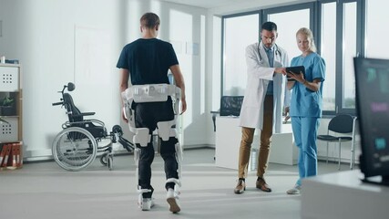 Aufkleber - Hospital Physical Therapy: Doctor and Rehabilitation Specialist Use Tablet Computer, Helps Disabled Patient with Injury Walks while Wearing Advanced Robotic Exoskeleton Legs. Advanced Physiotherapy