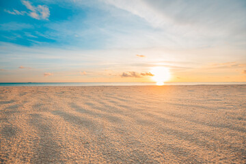 Closeup sea sand beach. Panoramic beach landscape. Inspire tropical beach seascape horizon. Orange and golden sunset sky calmness tranquil relaxing sunlight summer mood. Vacation travel holiday banner