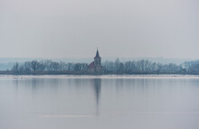 Church Across The Water Surface