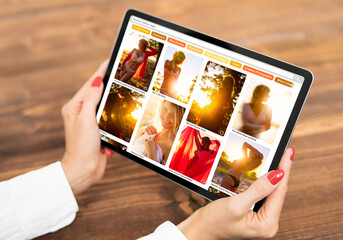 Wall Mural - Woman browsing beautiful and artistic fashion photos online