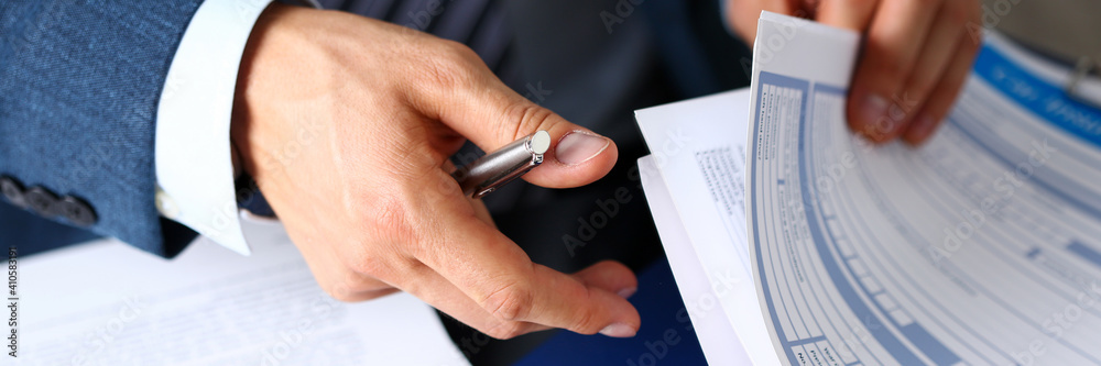 Male arm in suit offer insurance form clipped to pad and silver pen to sign closeup. Strike a bargain, driver money loss prevention, secure road trip, harmless drive idea, owner protective concept - obrazy, fototapety, plakaty 