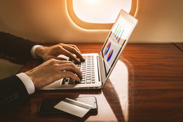 Businessman flying on private jet