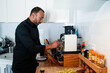© SYCprod - Handsome man making coffee at home