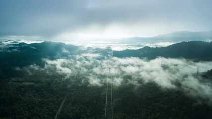 Wall Mural - 4k hyper lapse video, flying through the clouds above the mountain peak beautiful morning natural sc
