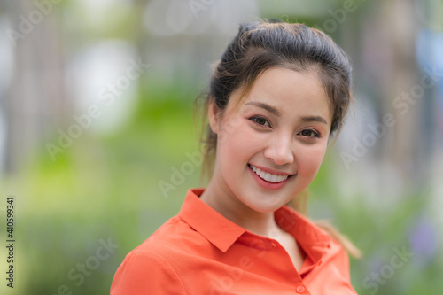 Outdoors portrait of Happy young woman © Naypong Studio