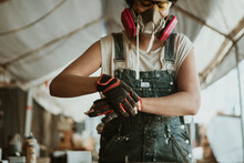 Female Carpenter Wearing Personal Protective Equipment