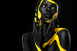 © Mike Orlov - Yellow and black body paint. Woman with face art. Young girl with colorful bodypaint. An amazing afro american model with makeup.