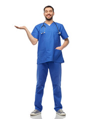 Sticker - healthcare, profession and medicine concept - happy smiling doctor or male nurse in blue uniform with stethoscope holding something imaginary on empty hand over white background