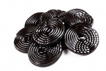 Licorice Candy Wheels On White Background.