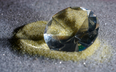 Poster - Closeup shot of the diamond on the shiny sand