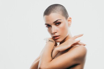 Wall Mural - Modern beauty portrait. Young woman with shaved head