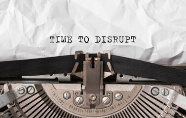 Poster - text time to disrupt typed on retro typewriter