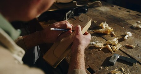 Poster - Cinematic macro of master artisan luthier working on creation of handmade fine quality wood violin in creative workshop. Concept of spiritual instrument, handmade, art, orchestra, artisan, music.