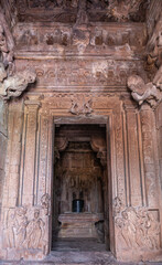 Wall Mural - Bagalakote, Karnataka, India - November 7, 2013: Pattadakal temple complex. Inside sanctum of Jambulingeshwara temple. All surfaces covered by sculptures, Shivalingam on yoni in its inner sanctum.