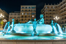 Historical Fountain Of Neptune In Plaza De La Virgen At Night. Valencia Spain.
