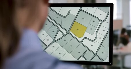 Wall Mural - woman working with digital cadastral map land register database on computer in office. building plot