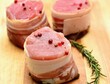 Raw bacon wrapped pork tenderloin medallions