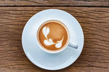 Cappuccino  on the wooden table. Cappuccino art concept.