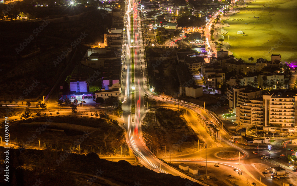 High Angle View Of Illuminated City Street And Buildings At Night - obrazy, fototapety, plakaty 