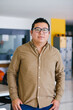 © Marcos - plus size latin Man portrait looking to camera outside office in Mexico city