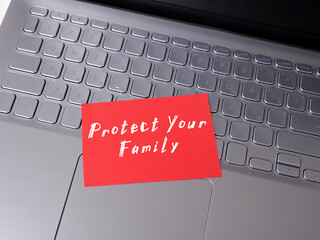 Wall Mural - Business concept about Protect Your Family with inscription on the sheet.