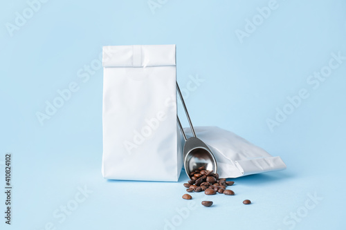 Coffee bags on color background © Pixel-Shot