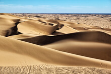 Sand Dunes In Desert Against Sky