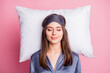 © deagreez - Top above high angle view photo portrait of satisfied woman sleeping on pillow isolated on pastel pink colored background