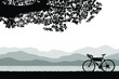 Silhouette of bicycle is parking near the lake with a mountain backdrop. Vector