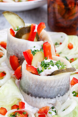 Wall Mural - Pickled herring rolls with vegetables.