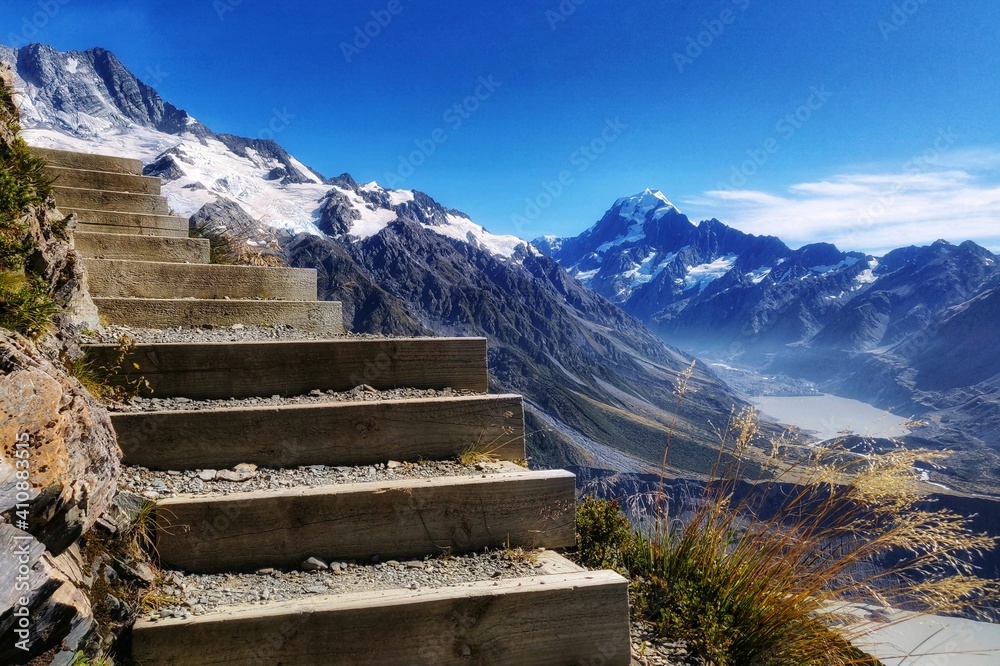 Scenic View Of Snowcapped Mountains Against Blue Sky - obrazy, fototapety, plakaty 