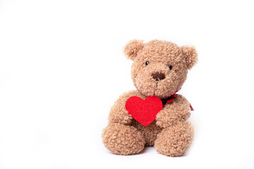 teddy bear holding heart isolated on white background
