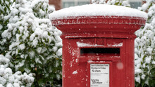 Close Up Of A Red Post Box In The Snow At Christmas	
