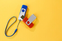Usb Flash Drives On Yellow Background