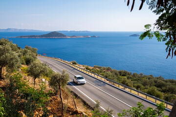 Car driving along the Mediterranean coast in southern Turkey