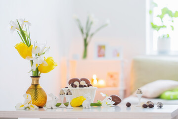 Wall Mural - Easter decorations with spring flowers in white interior