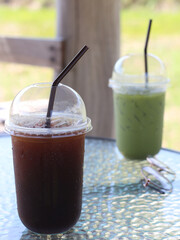 Americano black coffee with ice on table