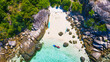 A top view over Koh Lipe island with the crystal clear water and people were doing kayaking.
