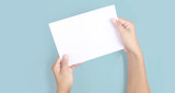 Fototapeta Mapy - Hands holding paper blank for letter paper