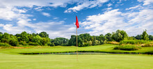 Golf Course On A Summer Day With A Flag, Green Golf With Red Flag