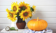 Sunflowers In A Jug. A Bouquet Of Flowers.