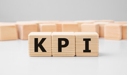 Poster - word kpi made with wood building blocks