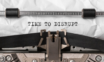 Poster - text time to disrupt typed on retro typewriter