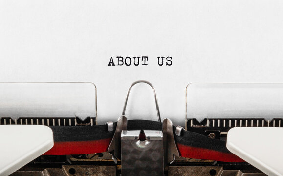 Text ABOUT US typed on retro typewriter