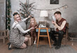 © Alexey Kuznetsov - Dad shoots a vintage film camera of a child at home on Christmas day