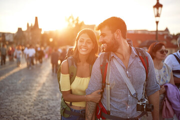 Happy tourist couple sightseeing; Traveller lifestyle