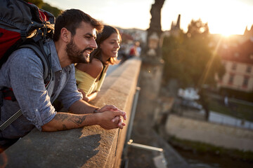 Happy tourist couple sightseeing; Traveller lifestyle