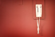 © jdoms - Retro vintage telephone on red wall