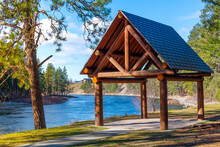 A Log Built Gazebo Or Outbuilding Along The Spokane River In The City Of Post Falls Idaho In The Inland Northwest Of The United States.